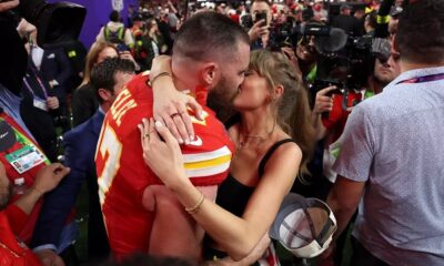 Travis Kelce and Taylor Swift kiss after the 2024 Super Bowl