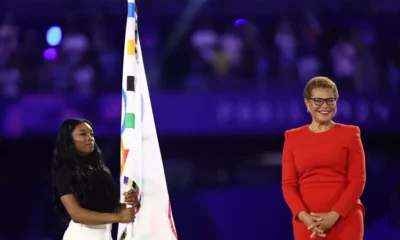 Simone Biles,The Three time Gold Medalist Carries the Olympic Flag During Paris Closing Ceremony as Olympics Transition to Los Angeles...