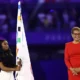 Simone Biles,The Three time Gold Medalist Carries the Olympic Flag During Paris Closing Ceremony as Olympics Transition to Los Angeles...